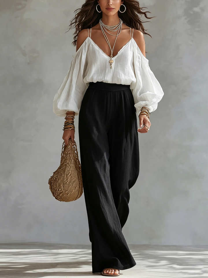 Top senza spalline bianco e pantaloni larghi neri