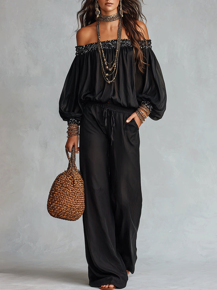 Top Nero Con Paillettes Senza Spalline Abbinato A Pantaloni Larghi Con Coulisse