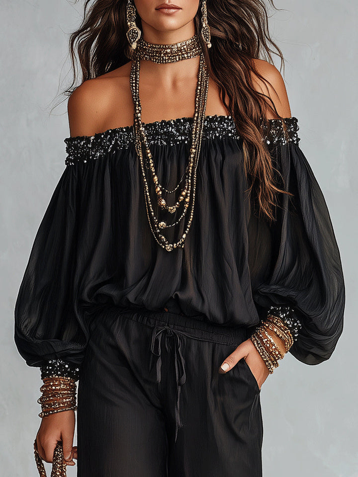 Top Nero Con Paillettes Senza Spalline Abbinato A Pantaloni Larghi Con Coulisse