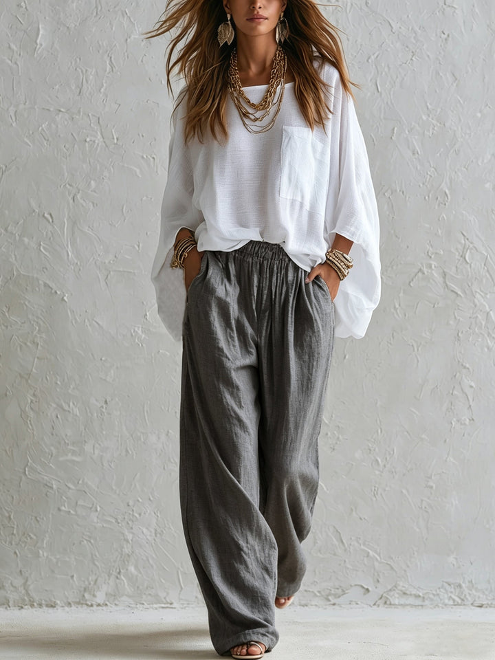 Completo con Top Bianco Lungo e Pantaloni Grigi a Vita Elastica a Gamba Larga