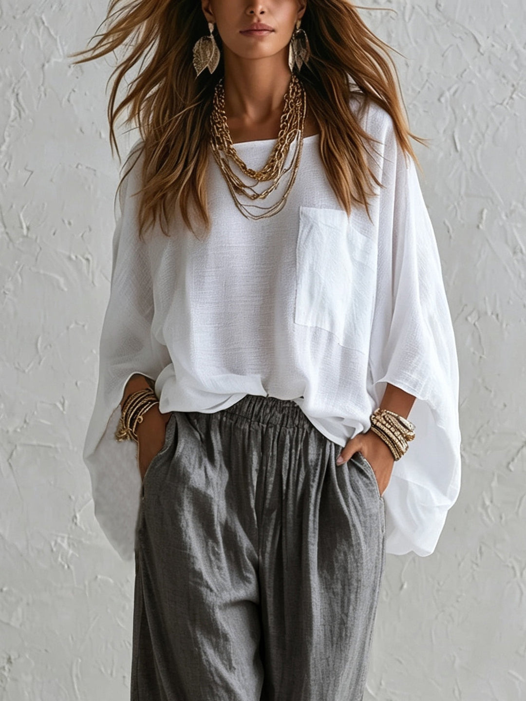 Completo con Top Bianco Lungo e Pantaloni Grigi a Vita Elastica a Gamba Larga