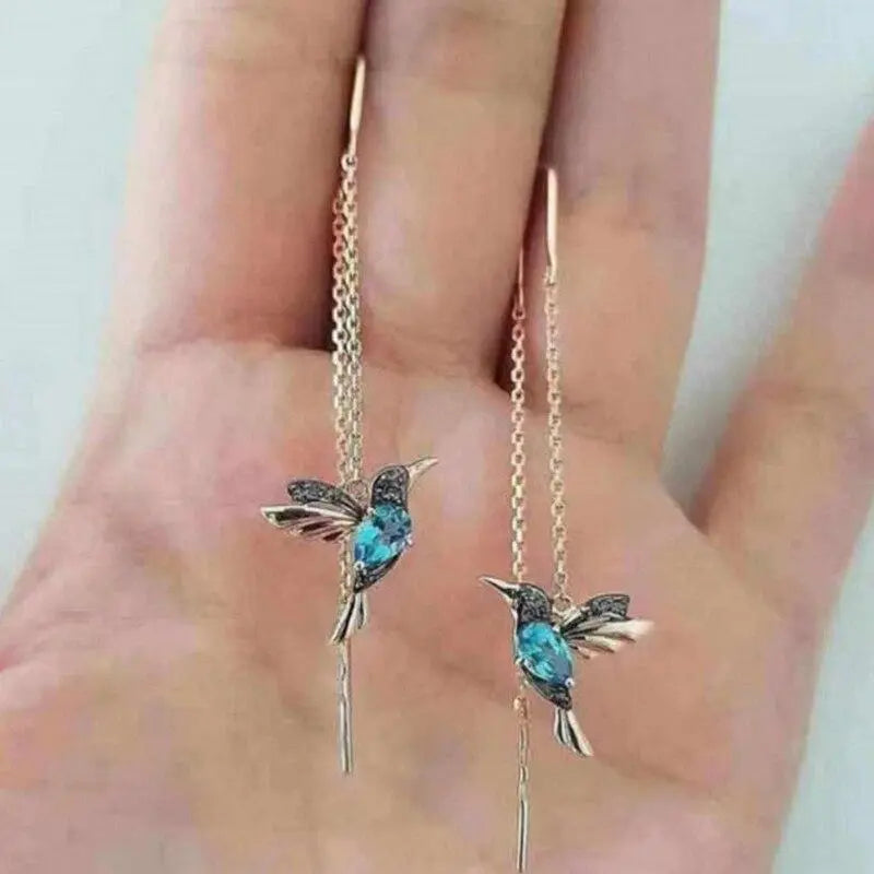 Orecchini in filo con colibrì in oro e cristalli
